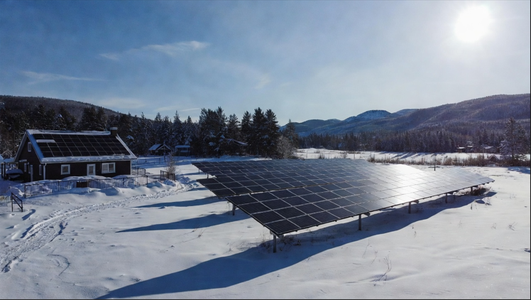 Ground mounted and roof mounted solar panels in Canada with winter sunlight