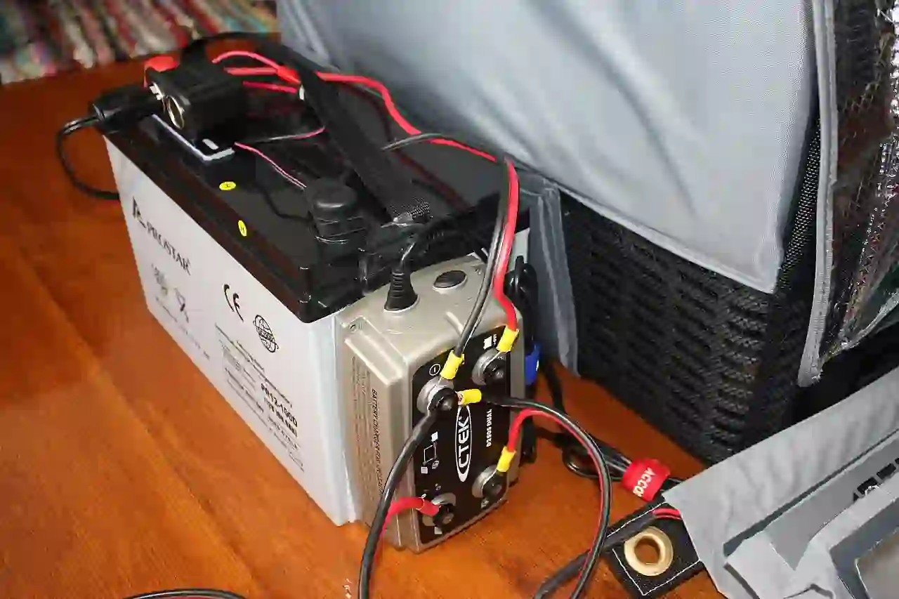 Vehicle auxiliary battery and charger Auxiliary AGM battery and DC-to-DC charger in a vehicle