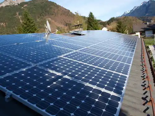 Solar panels on a roof in a mountainous landscape
