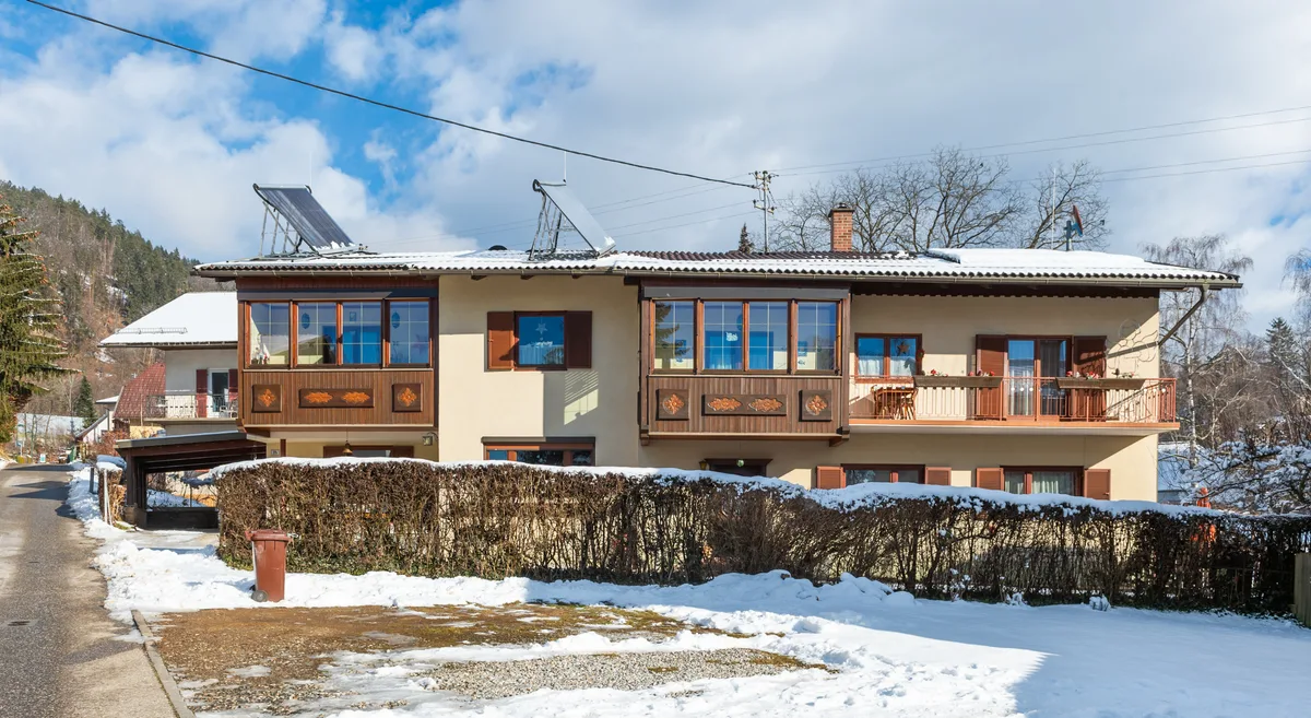 Residential building with rooftop solar panels in Austria Residential building in Carinthia, Austria, with solar panels visible on the roof