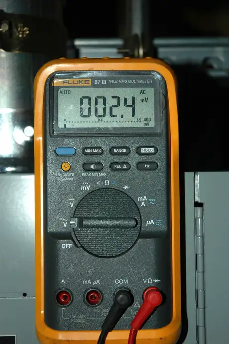 Digital multimeter measuring electrical voltage and circuit continuity