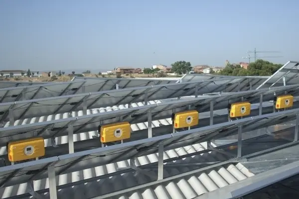 Solar power inverters mounted inside an electrical utility room