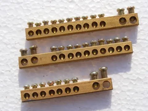 Heavy copper grounding busbar and equipment bonding conductors inside an electrical power center