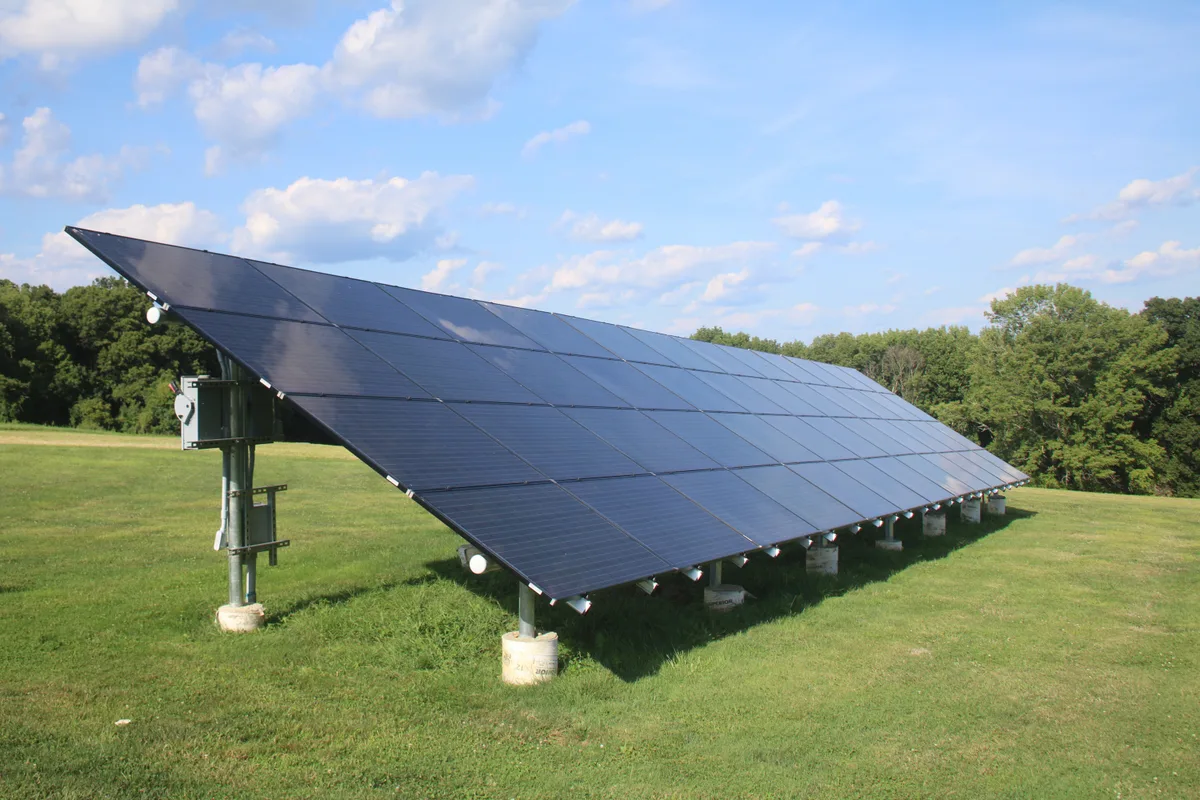 Photovoltaic solar array installed on a ground mounting rack to satisfy off-grid tiny home solar requirements in winter