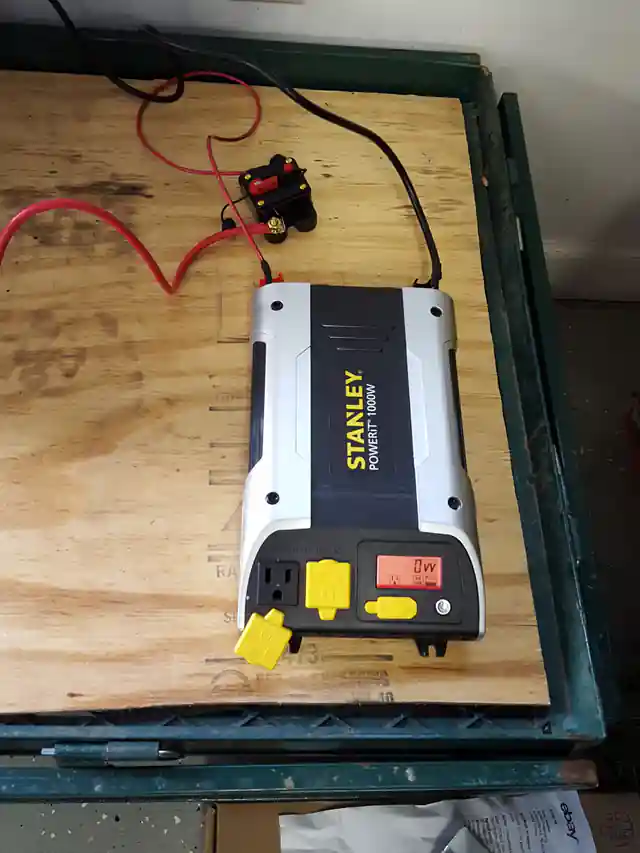 Heavy-gauge copper battery interconnect cables and terminal protection on an off-grid solar system